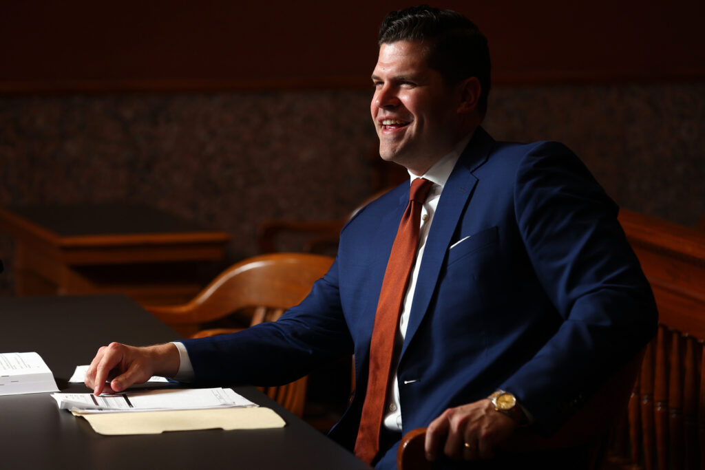 A photo of Norris Legal Group founder Graham Norris sitting in a courtroom.