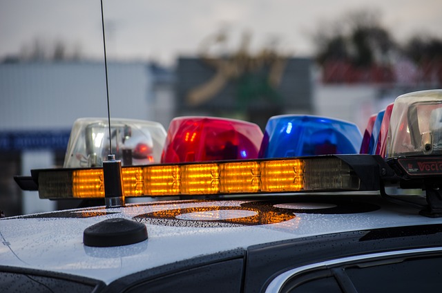 A close-up of the multi-colored lights on top of a police car.