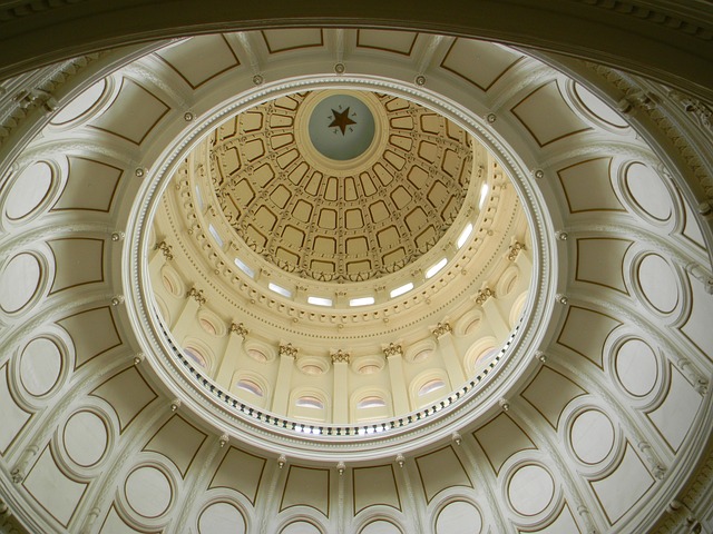 A view of the Texas state capitol dome from inside the building looking up into the inside of the dome.